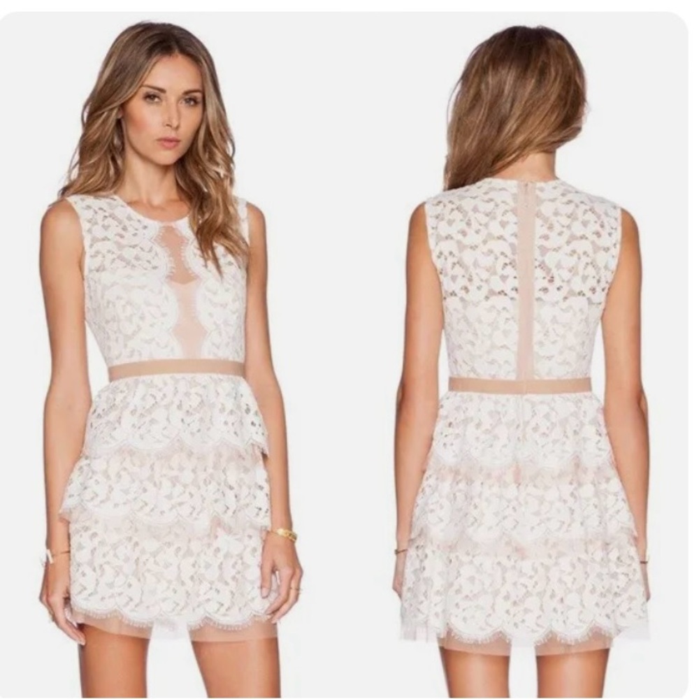 Gorgeous cream lace dress with nude netting detail with rows of ruffles